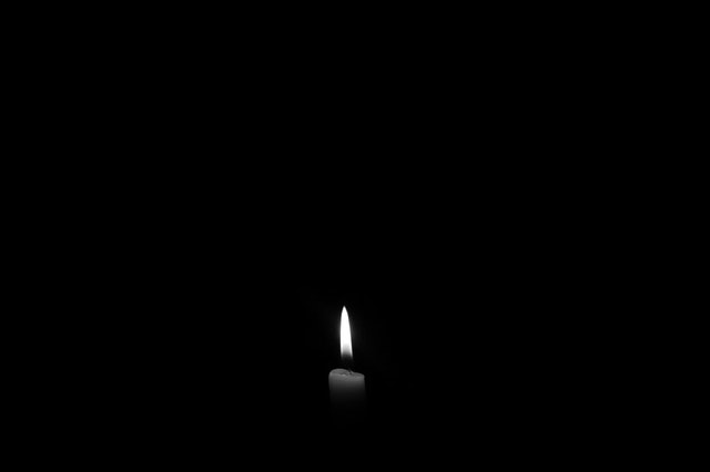 darkness with a candle
